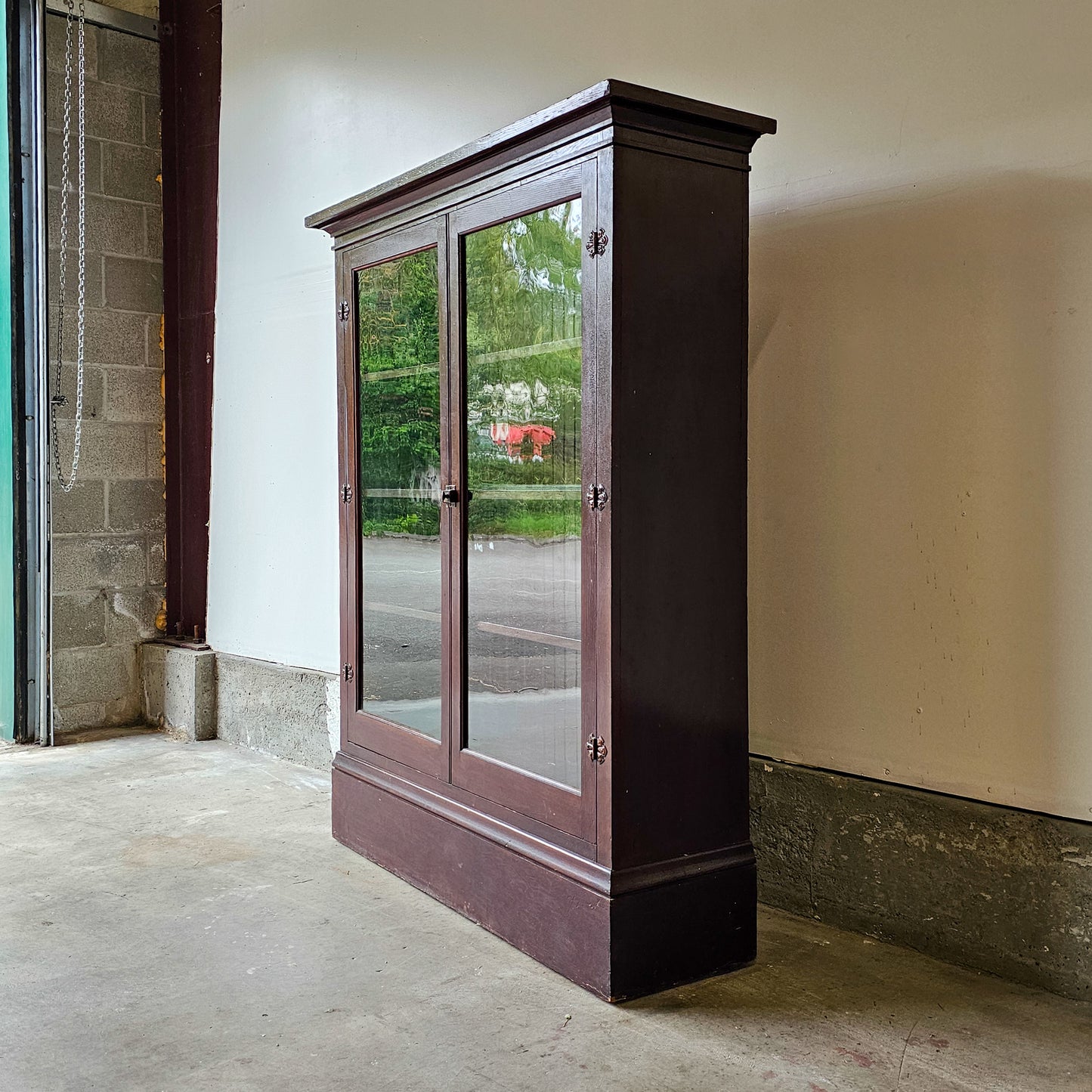 Antique wood cabinet with glass doors