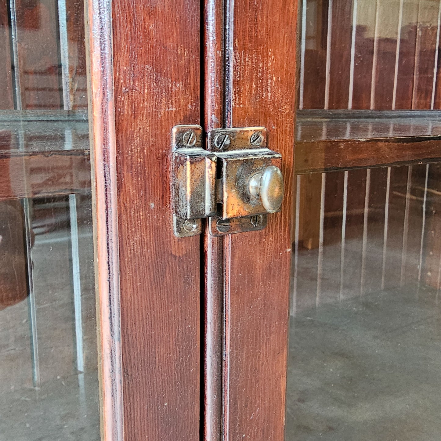 Antique wood cabinet with glass doors