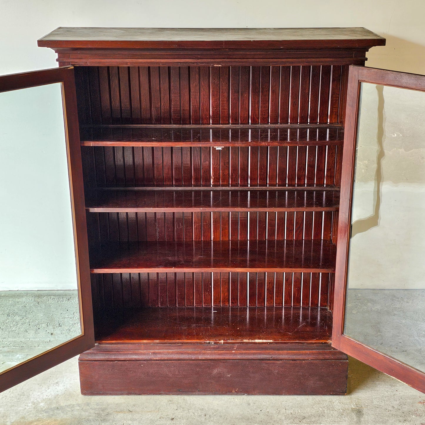 Antique wood cabinet with glass doors