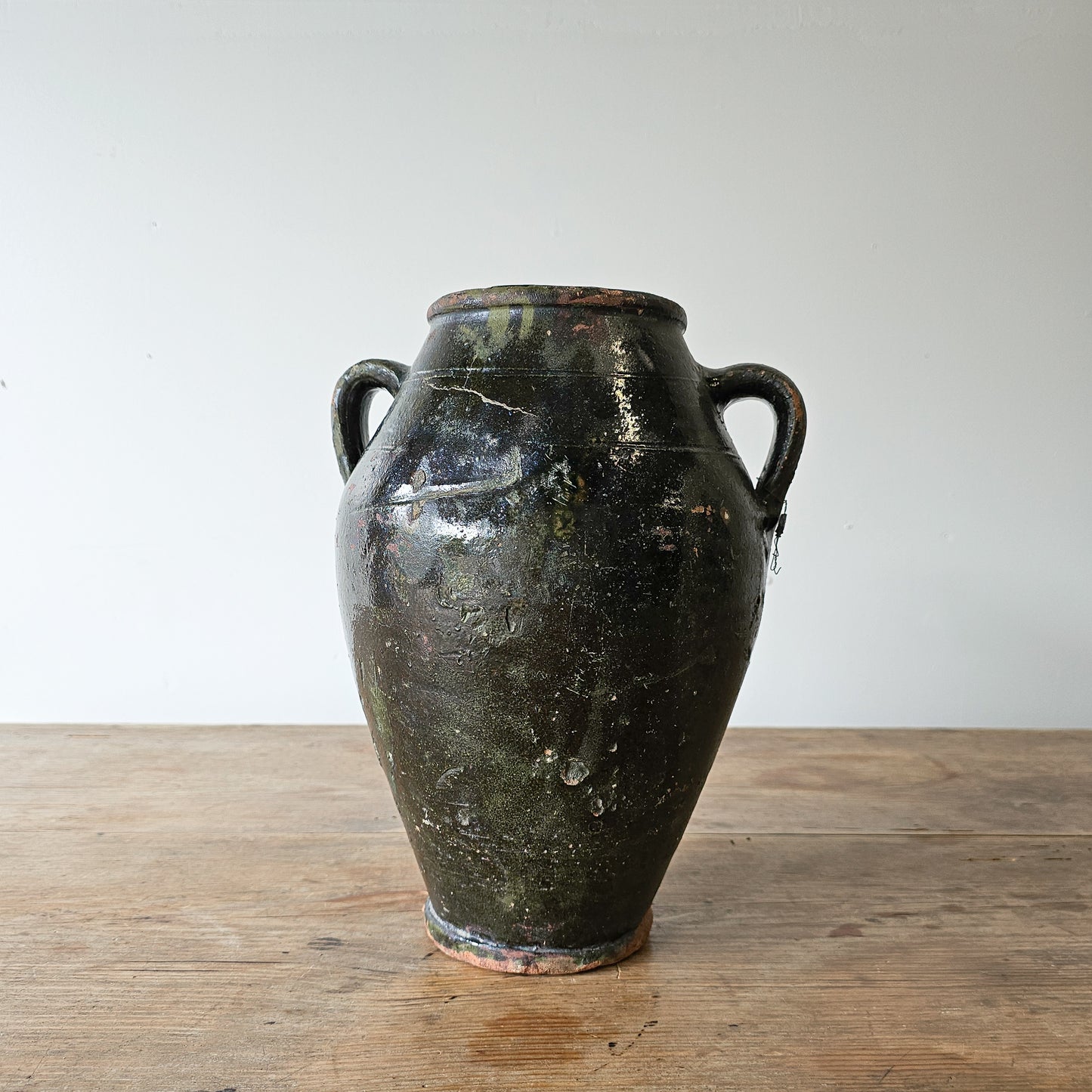 Vintage dark green glazed olive jug pottery