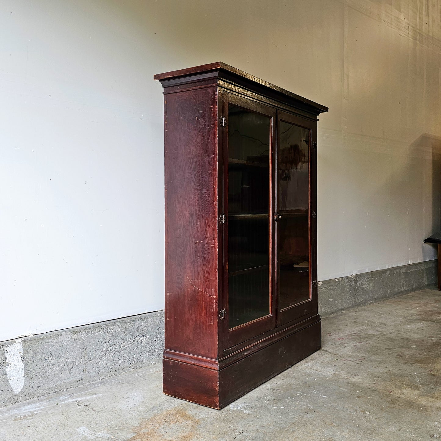 Antique wood cabinet with glass doors