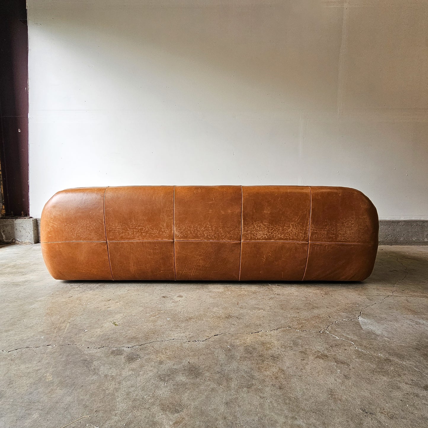 CB2 Chrome Brace Saddle leather tufted sofa-Discontinued Model