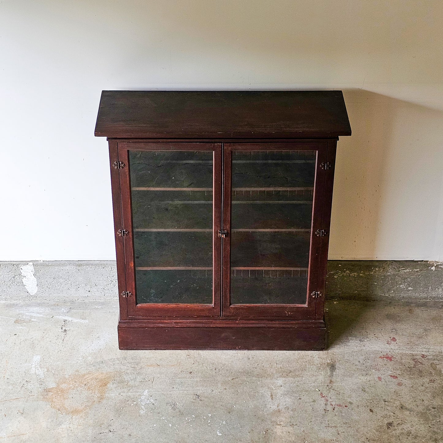 Antique wood cabinet with glass doors