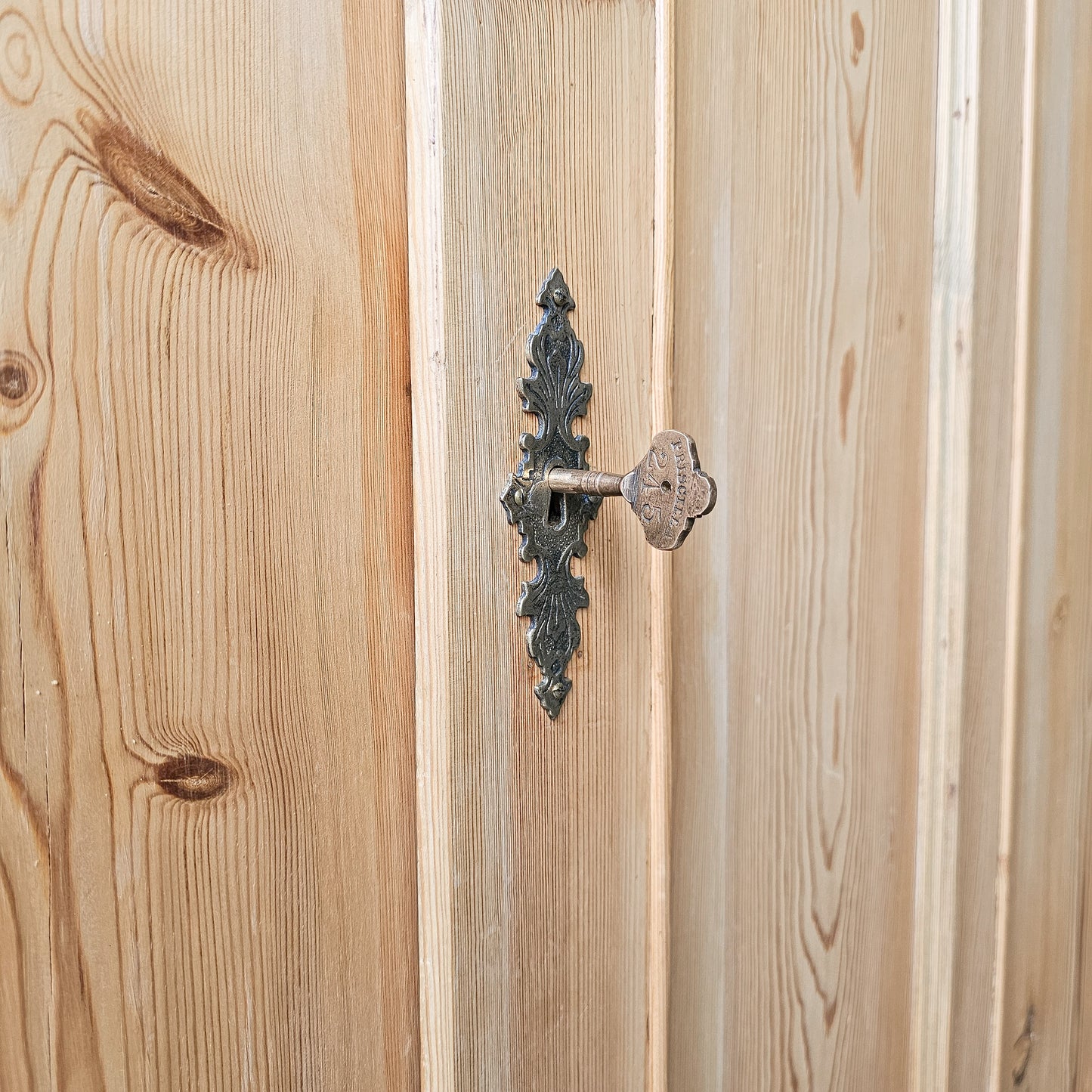 Antique pine single-door armoire cabinet