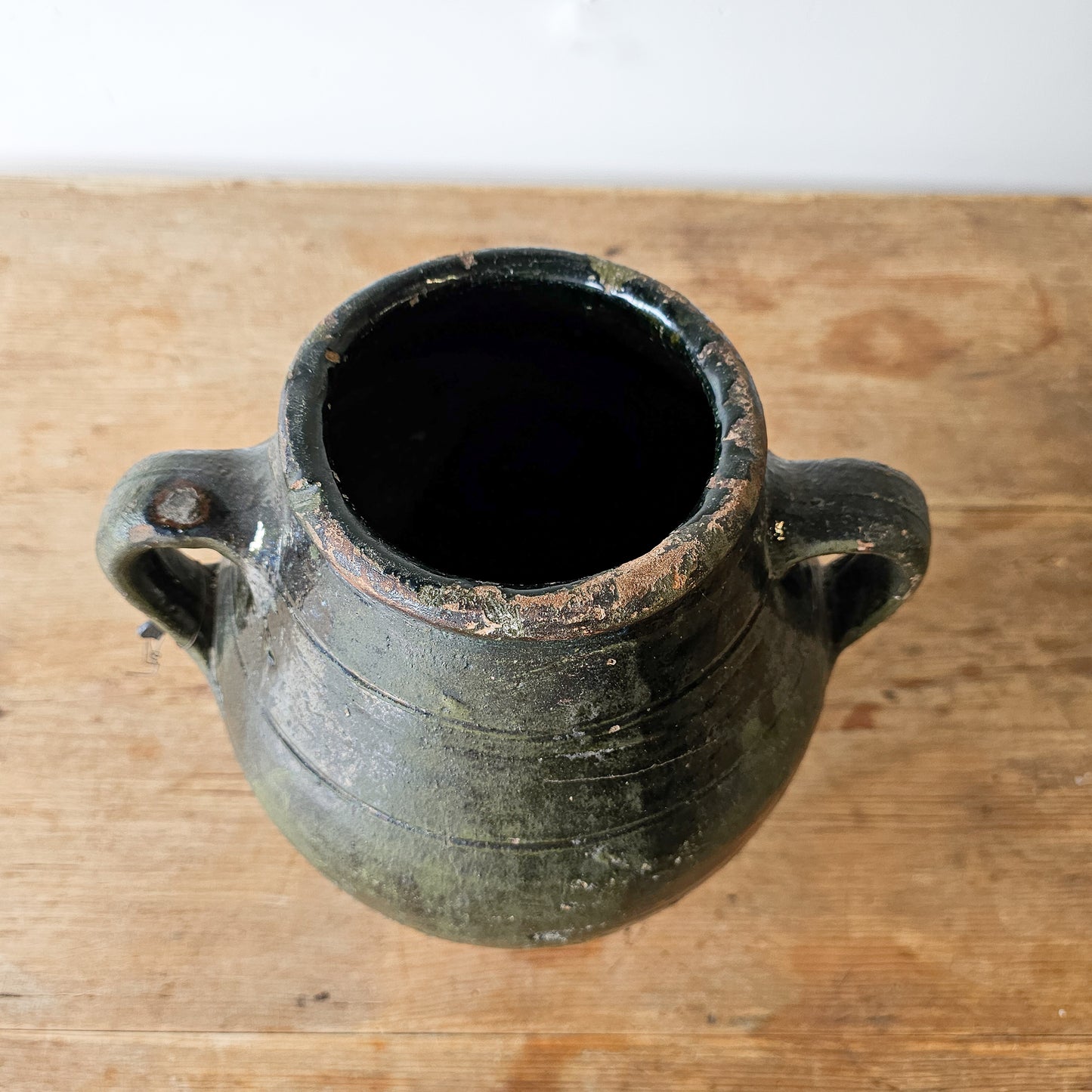 Vintage dark green glazed olive jug pottery