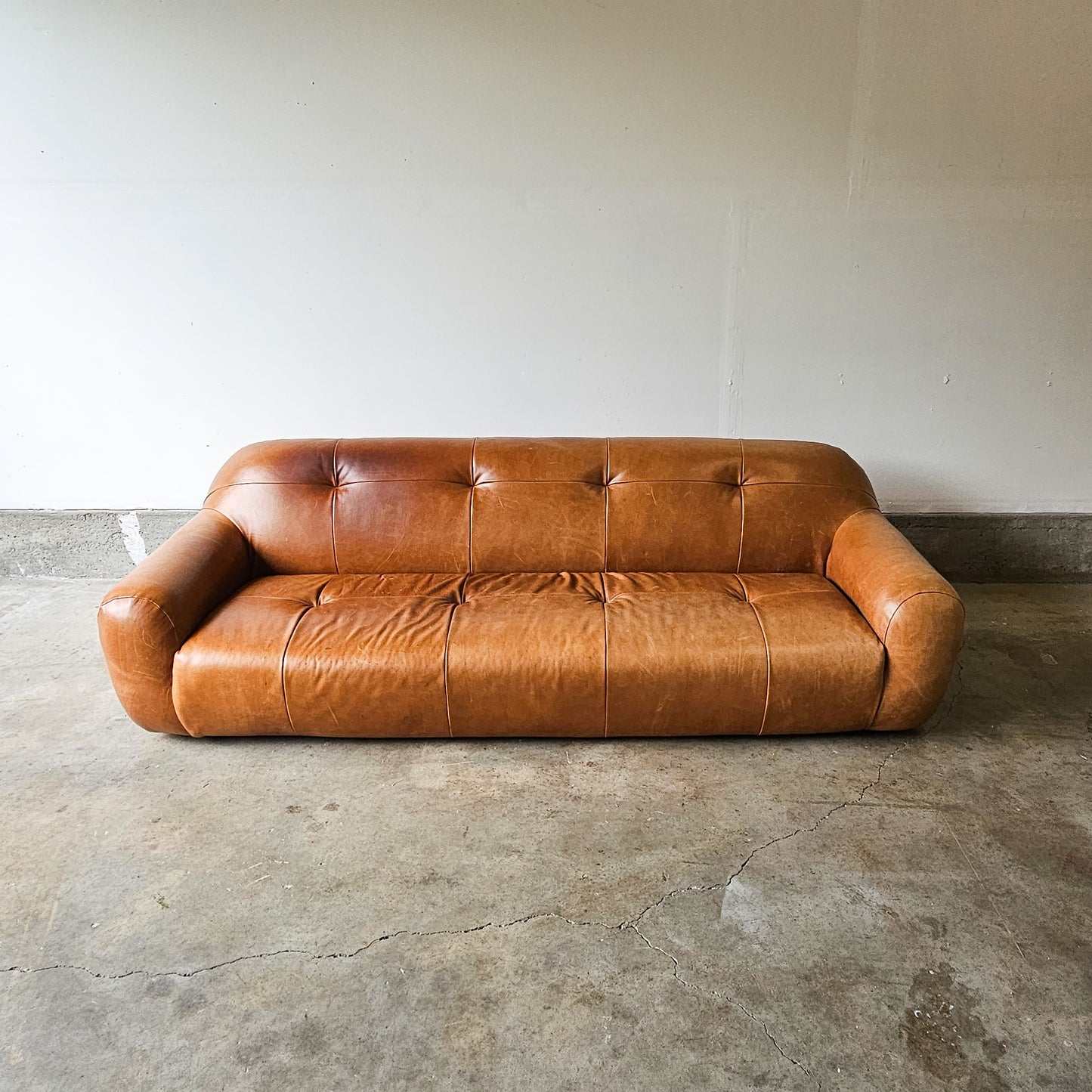 CB2 Chrome Brace Saddle leather tufted sofa-Discontinued Model
