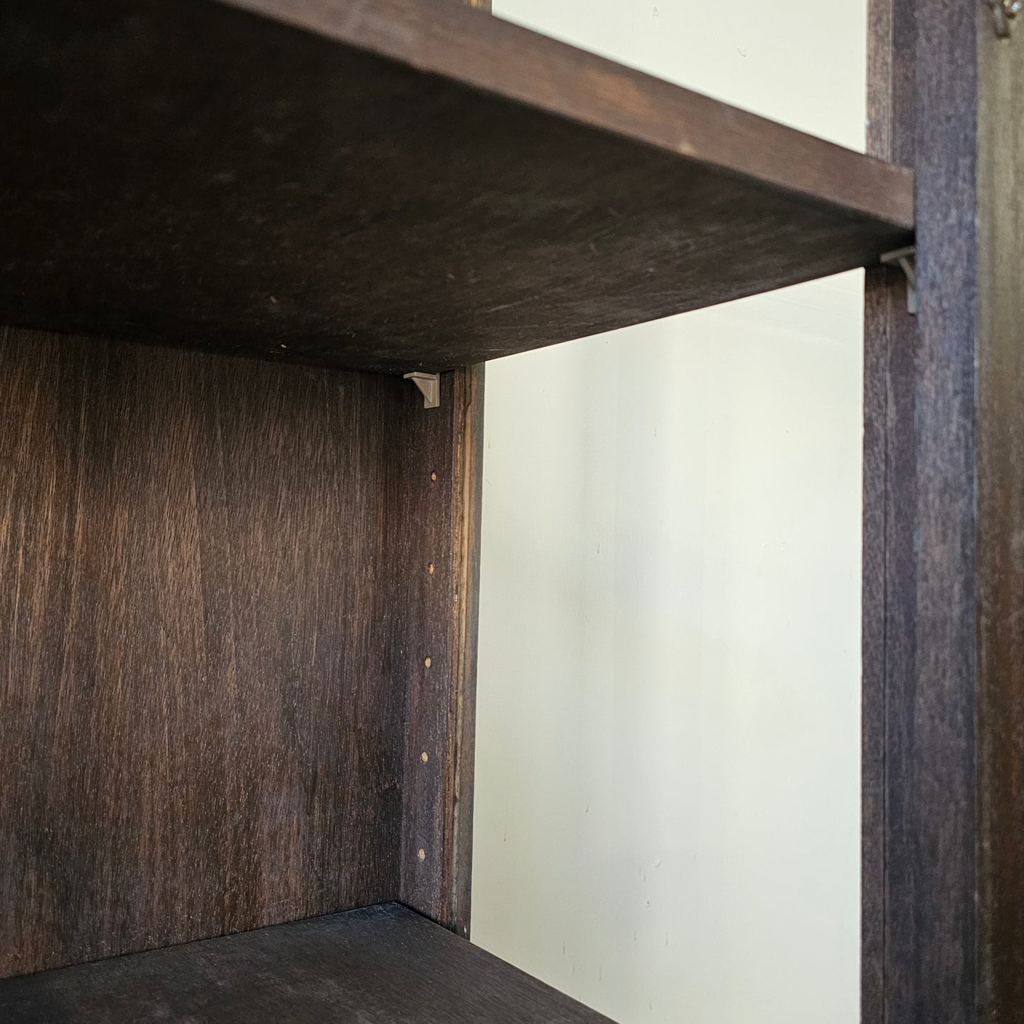 Antique glass-front scalloped trim cabinet