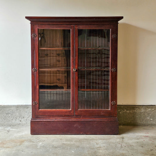 Antique wood cabinet with glass doors