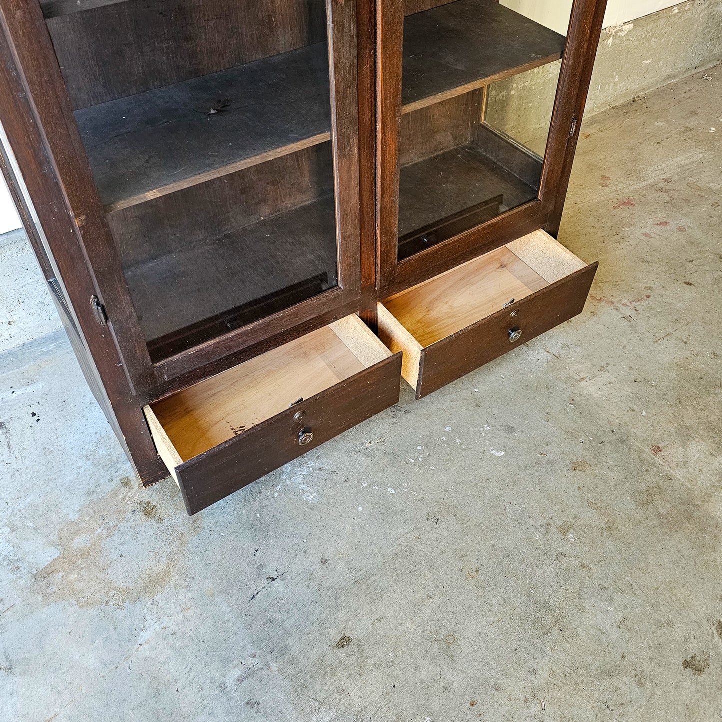 Antique glass-front scalloped trim cabinet