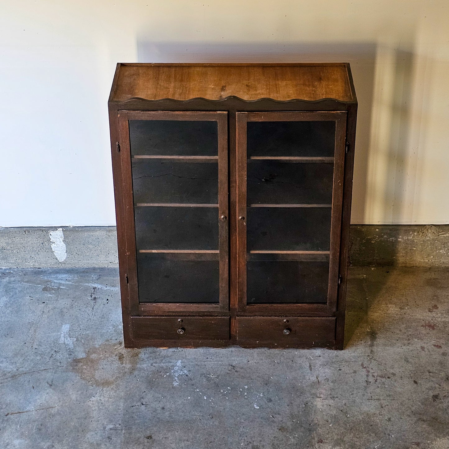 Antique glass-front scalloped trim cabinet